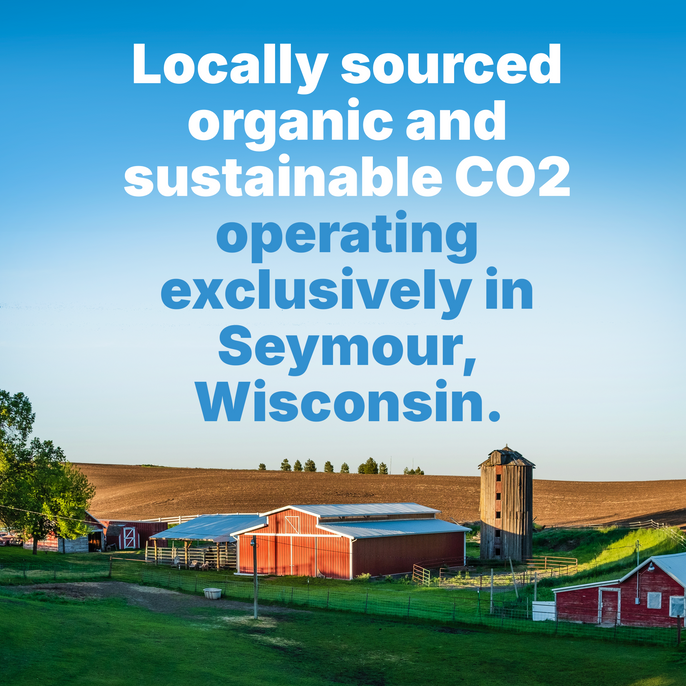 Rural farm landscape with red barns and a wooden silo under a clear blue sky. Overlaid text reads: 