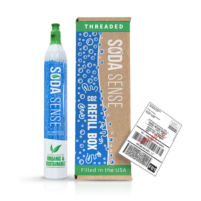 A threaded Soda Sense CO2 refill canister stands next to a cardboard refill box and a shipping label