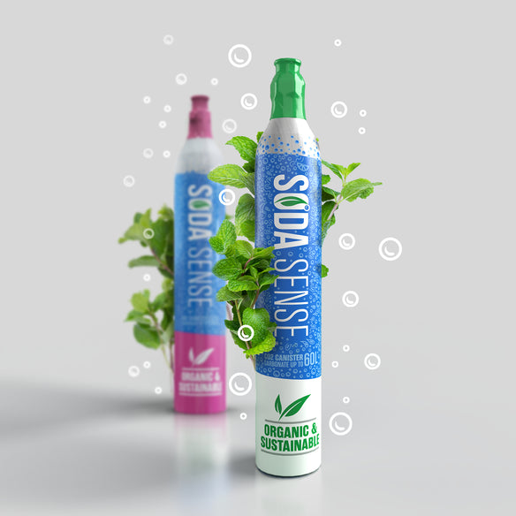 Two Soda Sense CO2 canisters, with fresh mint leaves spiraling around them, emphasizing the organic and sustainable quality of the product.