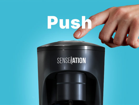 Person pressing a the button on the Soda Sense SENSEation soda maker, with the word 
